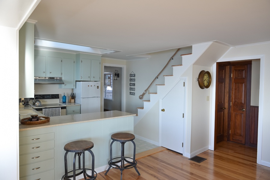 Small but Efficient U-Shaped Kitchen with Pass-thru to Private Seating Nook
